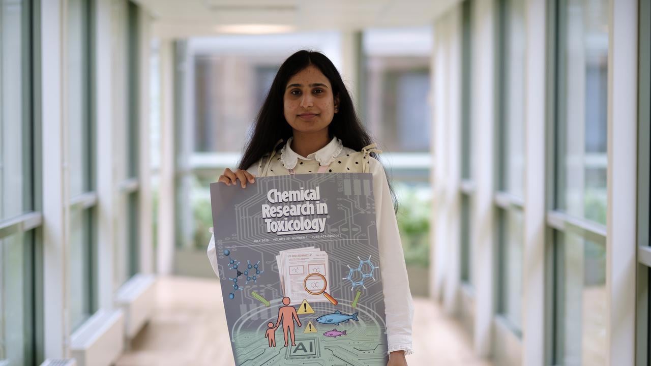 Farina holding a poster
