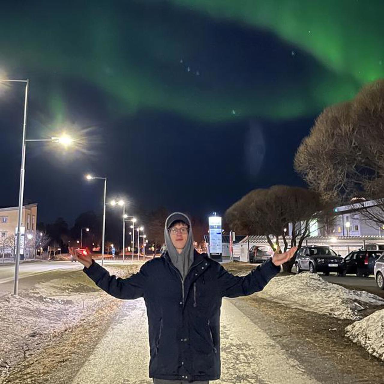 student experiencing the northern lights