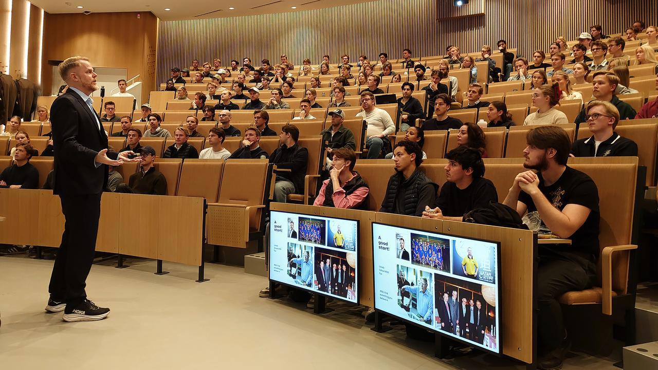 A man in front of an audience.