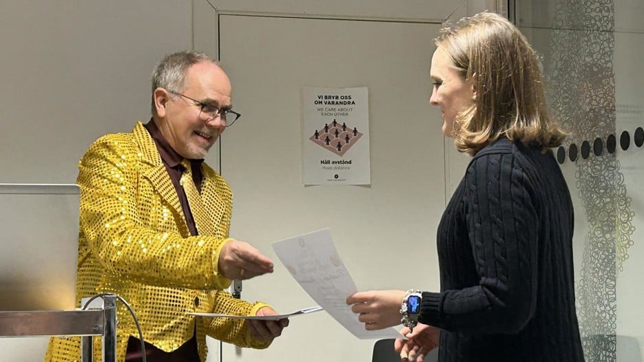 A man and a woman standing next to each other.
