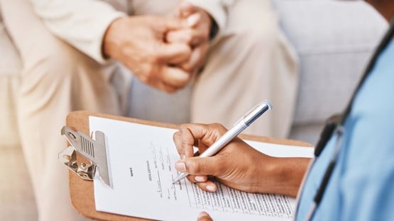 Nurse, clipboard and medical checklist with patient for healthcare, life insurance or hospital service. Closeup doctor writing notes, consulting and report documents of surgery, test results and data