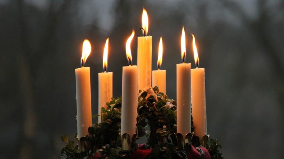 Close-up of a Lucia crown with lit candles