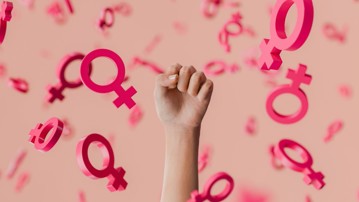 Woman raising fist surrounded by pink female gender symbols promoting girl power, feminism, and women's rights. 3d rendering