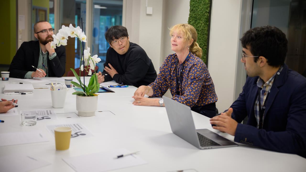 Professor Åsa Strand discusses a new project idea in plant stress response modeling with other researchers, including Seong-Gyu Yang, IceLab and Department of Physics postdoctoral fellow.