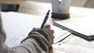 close up of person writing