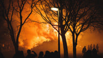 Intense flames from a massive forest fire. Flames light up the night as they rage thru pine forests and sage brush.