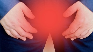 En mans skrev med röd markering. För att illustrera prostatacancer.