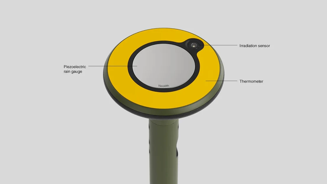 The top surface is equipped with additional sensors for measuring precipitation, temperature, and sunlight levels.