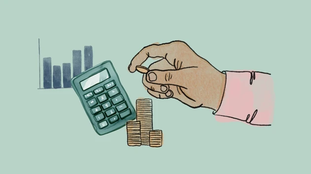 A calculator and a hand piling coins into stacks. A graph in the background. 