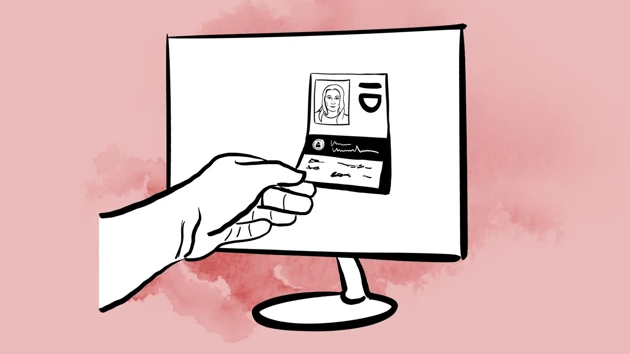 A hand picks out an ID card from a screen.
