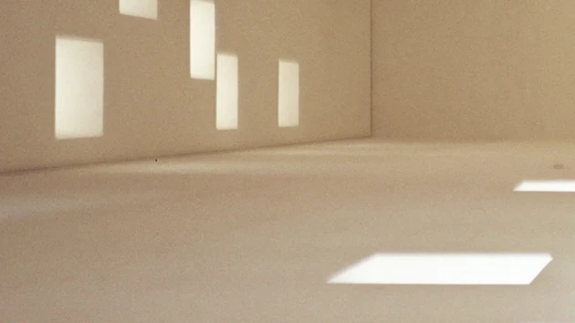 Abstract image of empty room with windows and light reflections