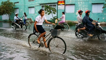 Översvämmad gata I Ho Chi Minh-staden.