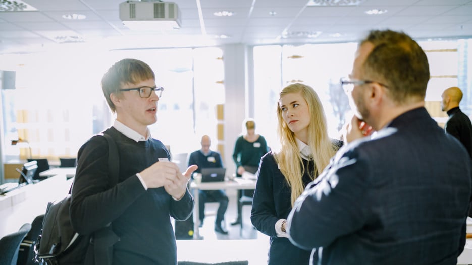 Three colleques discussing a topic