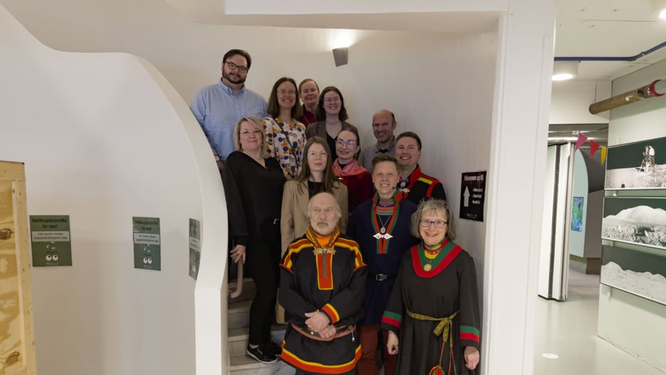 Gathering of smiling people standing in a staircase