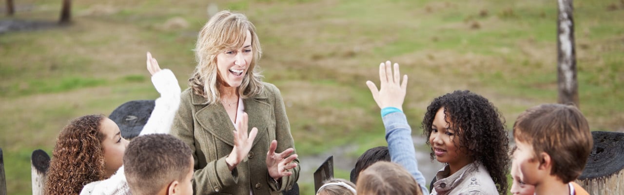 Teacher with group of children at zoo