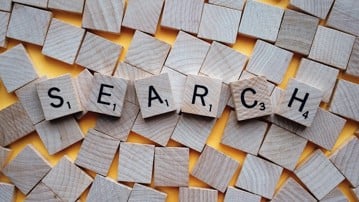 Scrabble tiles form the word search